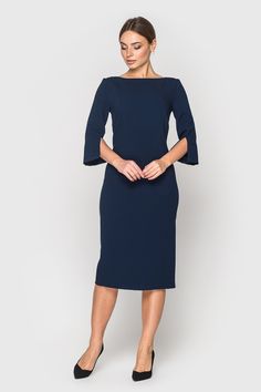 A minimalist pencil dress featuring boat neckline, 3/4 sleeves with slits, and a midi length. - boat neckline - pencil silhouette - midi length - 3/4 sleeves with slits - concealed back zipper closure - fully lined You can wash AUDREY in your washing machine with 30 degrees. Hang on a hanger to dry ist. And then it is ready to wear again! The outer fabric consists of 40% viscose, 55% polyester and 5% elastane. The lining consists of 55% viscose, 40% polyester and 5% elastane. Please choose from Cape Dresses, Mother Of Groom Dress, Queen Dresses, Spring Wedding Guest Dress, Corporate Dress, Elegant Cocktail Dress, Pencil Dresses, Navy Blue Midi Dress, Pencil Silhouette