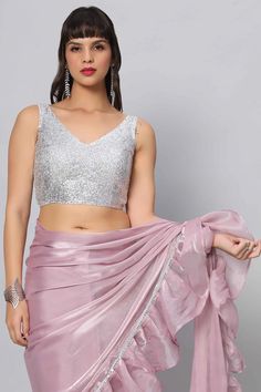 Shimmer & Shine in this simple silver sequins blouse which can pair well with almost any saree! Product Features: Color: Silver Fabric: Sequin Closure: Back Sizing: Not stretchable - margin of 2 inches inside seams for adjustments Occasion: Party, Wedding, Bridesmaid, Festive Product Type: Blouse Disclaimer: There will be slight difference in digital to actual image Glamorous Sleeveless Sequined Pre-draped Saree, Sleeveless Pre-draped Saree With Sequins For Party, Party Wear Pre-draped Sleeveless Saree With Unstitched Blouse, Sleeveless Pre-draped Saree For Diwali, Bollywood Style Pre-draped Sleeveless Saree With Mirror Work, Sleeveless Summer Festive Pre-draped Saree, Summer Festive Sleeveless Pre-draped Saree, Sleeveless Pre-draped Saree With Mirror Work For Party, Elegant Sleeveless Sequin Choli