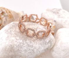 DESCRIPTION: 14k Solid Rose Gold Open Chain Link Ring with Diamonds Metal: 14k rose gold Diamond Information: Quantity: 98 diamonds Weight: 0.25ct Color: H Clarity:SI1-SI2 To see more rings from my collection, please click on the link below : https://www.etsy.com/shop/EderraFineJewelry?ref=hdr_user_menu-shop ABOUT Ederra | Release Your Inner Goddess Gold is one of the oldest metals on this planet. It symbolizes humankind's journey to illuminate and refine oneself. It exerts positive energy and c Elegant Rose Gold Chain Ring For Anniversary, Elegant Rose Gold Chain Ring For Wedding, Elegant Rose Gold Wedding Chain Ring, Elegant Rose Gold Chain Ring With Adjustable Chain, Elegant Adjustable Rose Gold Chain Ring, Adjustable Chain Rose Gold Ring, Fine Jewelry Rose Gold Rings With Adjustable Chain, Rose Gold Adjustable Chain Ring Fine Jewelry, Rose Gold Chain Ring For Wedding Fine Jewelry