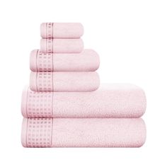 six pink towels stacked on top of each other