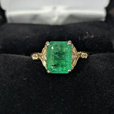 Fantastic Genuine 3.5 carat Zambian Emerald in a beautiful 14 karat yellow gold ring (size 7) with 4 white 1.7mm accent diamonds. The Emerald size is 10.01mm x 7.83mm x 5.26mm and is has minor oil applied (oiling is typical for emeralds). The GFCO Gem Lab testing document to confirm authenticity is included. Simply Stunning! Genuine Emerald Ring, Art Deco Emerald Engagement Ring, Formal 14k Gold Emerald Ring With Diamond Accents, Emerald Cut Yellow Gold Diamond Ring, Formal Yellow Gold Emerald Ring With Center Stone, Yellow Gold Emerald Diamond Ring With Vvs Clarity, Heirloom Emerald Ring In Yellow Gold With Diamond Cut, Classic Emerald Ring With Diamond Stamped 14k, Classic Emerald Ring With Diamond And 14k Stamp