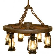 a chandelier with five lights hanging from it's sides and chains on the bottom