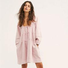 Color: Pink Acid Wash Fabric: 100% Cotton Oversized Fit Common To Fp So Sweet Denim Mini Dress Featured In A Babydoll Silhouette With Puffed Sleeves. Slash Hip Pockets Square Neckline Cinched Sleeves Spring Dresses With Ruffles In Relaxed Fit, Oversized Mini Length Dresses For Daywear, Relaxed Fit Long Sleeve Mini Dress For Spring, Spring Pink Dress With Relaxed Fit, Brunch Mini Dress With Relaxed Fit, Spring Mini Dress Relaxed Fit For Daywear, Relaxed Fit Long-sleeved Ruffle Dress, Relaxed Fit Dress For Spring Brunch, Spring Oversized Dress For Day Out