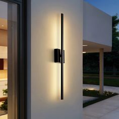 Our modern, barely-there outdoor wall sconce features a backlit design that uses integrated LEDs for bright, clear light. The square back plate can be rotated up to 350-degrees to mount the sconce horizontally or vertically. Use this minimalist wall light to add contemporary flair to an entry, living room, dining room, or bedroom.","Vara 28 Modern Minimalist Indoor/Outdoor Metal 350-Degree Rotatable Dimmable Integrated LED Wall Sconce, Black | JONATHAN Y Vara Modern Minimalist Indoor/Outdoor Metal 350-Degree Rotatable Dimmable Integrated LED Wall 28" High Sconce in Maroon | Mathis Home Sconces On Staircase Wall, Home Gym Lighting Ideas, Outside Lights On House, Outdoor Home Gym, Modern Exterior Lighting, Minimalist Wall Light, Exterior Wall Lights, House Fixtures, Entry Living Room