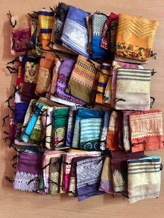 a wall hanging made up of many different types of scarves