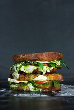 the grilled cheese sandwich with arugula pesto is served on toasted bread