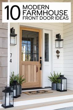 the front door is decorated with black lanterns and potted plants, which are on either side