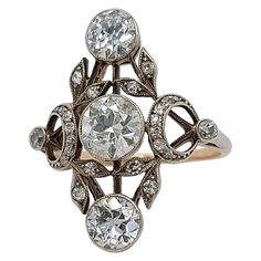 Stunning 18 kt Gold & Silver Ring With Diamonds from the 1900's ,Trilogy Diamonds: 25 diamonds ,3 Big Old Cut Diamonds 2° of Ca. 0.7 each and center Ca. 1 Ct. Material: 18 kt gold and silver Dimensions: Top of ring 20 mm x 24.6 mm Ring size: 57 Total weight: 3.6 gram / 0.125 oz / 2.3 dwt Nola House, Antique Diamond Jewelry, Gold And Silver Ring, House Castle, Belle Epoch, Vintage Silver Ring, Designer Diamond Jewellery, Unique Diamond Rings, Gold And Silver Rings