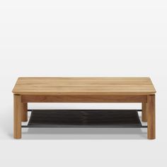 a wooden coffee table sitting on top of a metal shelf