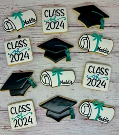 decorated cookies with graduation caps and tassels for class of 2021 on a table