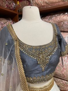 Jasmine white plain lehenga with gold border teamed with contrasting grey intricate in kundan, cut dana and stone work blouse and net dupatta. Fabric: Silk Occasion: Wedding Ceremony or Reception. WASH CARE INSTRUCTIONS - Please Dry clean only when it is applicable. Slight color variation is possible due to digital photography. This outfit can be customized in multiple colors and specific to client measurements. 120 days of production time is required and are for bulk orders only!Order are proce Festive Silver Lehenga With Cutdana Detail, Silver Lehenga With Cutdana For Festive Occasions, Semi-stitched Stone Work Dupatta, Semi-stitched Silver Choli With Zari Work, Silver Lehenga With Cutdana For Reception, Festive Silver Lehenga With Cutdana, Gold Choli With Stone Work For Reception, Wedding Lehenga With Stone Work For Eid, Eid Wedding Lehenga With Stone Work