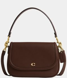 From COACH&#x2C; the Legacy Small Pebbled Leather Shoulder Bag features: Featuring a COACH logo flap&#x2C; this Legacy shoulder bag sits just beneath the underarm with the shorter strap or it can be worn as a crossbody. Small-sized bag; 10" W x 7.25" H x 2.75" D (width is measured across the bottom of handbag); 1.32 lbs. approx. weightApprox. 7.5" L removable short strap; 21.5" L removable crossbo Classic Coach Bags, Coach Brown Purse, Small Brown Shoulder Bag, Coach Small Purse, Brown Coach Shoulder Bag, Staple Designer Bags, Everyday Designer Handbags, Date Night Purse, Cute Everyday Purse