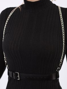 An elegant and alluring accessory, the Chain Suspender Harness features a sleek waist belt and chains that go straight over the shoulders. A sophisticated and versatile piece that adds a bold and stylish touch to any outfit. Perfect for those who embrace individuality and want to make a statement with their look, the harness can be paired with a form fitting dress for a sexy bold look or even with a blazer for an avant-garde style. Waist belt width: 3 cm Adjustable at the waist and shoulders Des