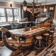 a kitchen with an island made out of wooden planks