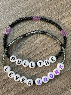 Pull The Lever Kronk! Set of two handmade beaded stretch bracelets. Glass seed beads and round letter discs spell out this movie phrase which even has its own meme! Careful don't let the vase fall on you!  Bracelets are available in a variety of lengths.  Pick your custom length from the drop down menu below.  All our bracelets are made with quality in mind.  With that being said, all bracelets should be treated with care while putting on, wearing, and taking off.  Keep dry. Do not swim or bath Bed Bracelet Ideas, Things Made With Beads, Homemade Bracelets With Beads Funny, Phrases To Put On Bracelets, Beaded Bracelets Funny, Bead Bracelets Words, Cute Bead Ideas, Friendship Bracelets Beads Funny, Friendship Bracelets With Beads Words