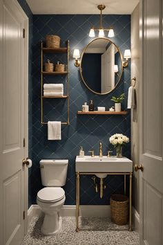 a white toilet sitting under a bathroom mirror next to a sink and a shelf filled with towels