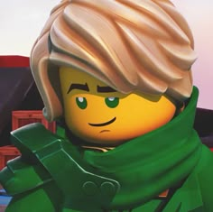 the lego movie character is wearing a green scarf and looking at something in front of him