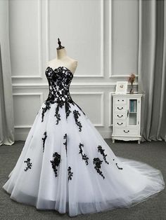 a black and white wedding dress on display