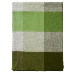 a green and white checkered blanket on a white background