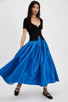 A true party staple, this special stunning skirt will turn heads with every wear. **Fit:** High-rise, full A-line silhouette **Features:** Sheen finish, pleating at top, finished hem, invisible zip closure, poplin fabrication **Why We ❤ It:** An essential piece to dress up or down, pair this with a silky cami or chunky sweater for endless ways to wear. | Emilia Full Skirt by Free People in Blue, Size: M Royal Blue Skirt, A Line Skirt Outfits, Lake Victoria, Maxi Skirt Style, Maxi Jumpsuit, Playsuit Dress, Pink Fits, High Risk, Invisible Zip