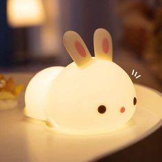 a white light that is shaped like a bunny rabbit with ears on it's head