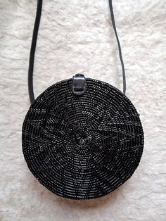 All Our black handwoven rattan bags are free shipping worldwide. We ship using express service and on average rattan bag reaches you within two to five days. Measurement of this this round rattan bag is approx 20cm Diameter, 7cm Height and 60cm strap ( 120cm ) Handwoven round black rattan straw cross body bag black lea Trendy Black Handwoven Bag, Trendy Black Straw Bag For Beach Season, Trendy Black Handwoven Shoulder Bag, Black Straw Bag For Beach Season Vacation, Black Summer Vacation Straw Bag, Black Straw Bag For Vacation, Summer Black Straw Shoulder Bag, Chic Black Shoulder Bag For Beach Season, Summer Evening Straw Bag