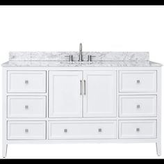 a white bathroom vanity with marble top and drawers