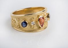 🎁 FREE Worldwide Shipping with DHL & FedEx EXPRESS Assured, fast delivery. ✈ Fine band created in our goldsmith workshop for a unique jewelry appearance. Detailed ancient royalty inspired design. ► Solid Gold 18K Band or 14k Band as selected. ► Natural Sapphires and natural diamonds. ✪ Natural Orange Sapphire: 0.44ct ✪ Natural Blue Sapphire: 0.39ct ✪ Natural Diamonds: 0.05ct ◘ Dimensions: 1.1cm width at top. ◘ Bottom: 0.5cm width WE CREATE FULL CUSTOM MADE , HIGH END JEWELRY LEAVE US YOUR M Ancient Royalty, Goldsmith Workshop, Byzantine Ring, Etruscan Jewelry, Byzantine Rings, Jewelry Sapphire, Girls Jewelry Box, Mens Gemstone Rings, Multi Gemstone Ring