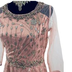 "A detailed full length heavy gown with exclusive hand made Aari, Sequence and stone work over net all over the piece with emphasis on the neck and waistline. The net material and layered can can lining gives it beautiful princess look drape and volume. This is a perfect fit for party and festive wear with a total length of 60\"." Pink Gowns, Stone Work, Indian Design, Festival Wear, Dress Clothes For Women, Full Length, Perfect Fit, Dress Outfits, Bathing Beauties