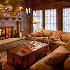 a living room filled with furniture and a fire place