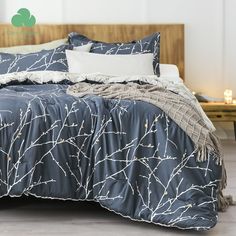 the comforter is made up with branches on it