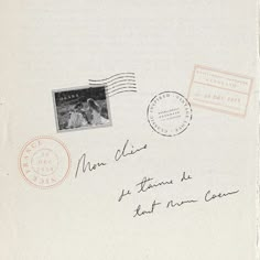 an envelope with two stamps on it and a postcard attached to the front cover