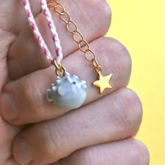 Get ready to be swept away by our adorable blowfish charm on a cozy cotton bracelet! This little porcelain puffer is dangerously cute and oh-so-tiny, guaranteed to steal your heart. The bracelet features a braided design and a golden star extension that adds a touch of charm to any outfit. Don't miss out on the cutest accessory around! 🥇 crafted from fine porcelain  meticulously hand painted in detail 🌳 heirloom quality ✔️ highly collectible 💝 individually gift boxed ✈️ free domestic shipping Blow Fish, Fish Bracelet, Pretty Fish, Cotton Bracelet, Fishing Bracelet, Animal Bracelet, Tiny Cottons, Golden Star, Shiny Things