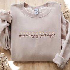 Embroidered Speech Language Pathology,Speech Therapist Sweatshirt,Speech Language Pathologist Shirt,SLP Supervisor Gift,Speech Gifts 💖Product Details: - Material: Crafted from a blend of 65% cotton and 35% polyester for comfort and durability. Available in a variety of colors and sizes, detailed in the product images. - Design Features: Reinforced with double-needle stitching at the collar, shoulders, armholes, cuffs, and hem, ensuring long-lasting strength. 💖 Care Instructions: To keep your sweatshirt in excellent condition: Machine wash cold, inside-out, on a gentle cycle. Tumble dry on low heat or hang to air dry. Use mild detergent with similar colors. Avoid dry cleaning, bleach, and fabric softeners. 💖 Shipping Information: Processing Time: 3-5 business days for order preparation. Pathologist Aesthetic, Supervisor Gifts, Speech Therapy Shirts, Slp Shirts, Speech Path, Therapy Shirt, Images Design, Speech Language Pathologist, Information Processing