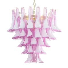 a pink chandelier hanging from a ceiling