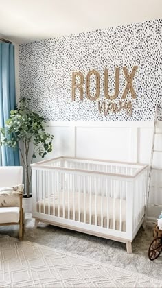 a baby's room with a white crib and blue curtains