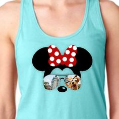 Minnie Mouse sunglasses tank top/Disney Cinderella’s castle with Pluto women’s summer tank top/Disney vacation Minnie bow silhouette tank featuring a Minnie Mouse silhouette with red polkadot bow and sunglasses with a silly Pluto at Cinderella’s castle reflection. The great athletic properties of this super soft cotton/poly tank top is sure to become your favorite tank. • 60% combed ringspun cotton, 40% polyester lightweight jersey• fabric laundered for reduced shrinkage • Racer back detail