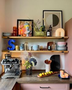 a kitchen counter with various items on it and a coffee machine in the corner next to it