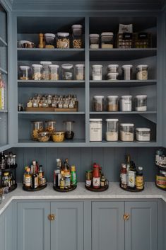 an organized pantry with lots of food and condiments on the shelves in it