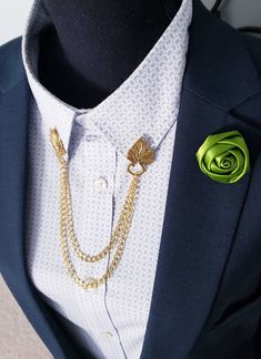 Looking for a unique and stylish accessory that can elevate your look and make you stand out from the crowd? Add a touch of nature and elegance to your outfit with this Elegant Leaf Collar Pin! It features a realistic leaf design that is made of high-quality alloy and steel. The leaf is attached to two gold chains that can be clipped onto your collar, lapel, blouse, or any other clothing item. This Elegant Leaf Collar Pin is completely customizable, so you can choose the length of the chains, th