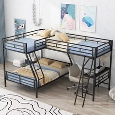 a bunk bed with a desk underneath it in a room that has hardwood floors and white walls