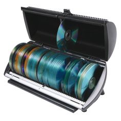 an open case with several discs in it and a roll of tape next to it