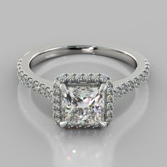 a princess cut diamond engagement ring with pave set shoulders