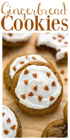 gingerbread cookies with white frosting and orange sprinkles are on a table