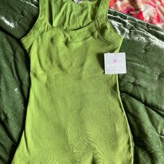 Athleta Green Tank. Size M New With Tags. Casual Fitted Scoop Neck Activewear, Sporty Tank Top For Spring Loungewear, Sporty Spring Loungewear Tank Top, Basic Scoop Neck Summer Activewear, Basic Scoop Neck Activewear For Summer, Sporty Solid Color Tank Top For Spring, Green Fitted Athleisure Tank Top, Green Seamless Tank Activewear, Green Sporty Seamless Tank Top