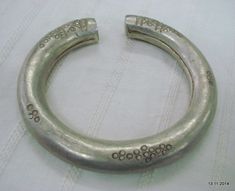 "VINTAGE ANTIQUE TRIBAL OLD SILVER BRACELET BANGLE SET 2pc FROM RAJASTHAN INDIA, NICE DESIGN EASY TO WEAR BY LITTLE TWIEST, GOOD FOR JEWELRY COLLECTION. Note - set is much worn & dent check pictures carefully for more detail. weight for set - 144 grams Inner diameter side to side - 6.5 cm(2.55\") Ineer circumference without open part - 17.8 cm(7\") width - 1.2 cm material - Silver and original old worn set." Traditional Silver Metal Bangle, Unique Heavy Silver Bangle, Vintage Antique Silver Round Bangle, Unique Silver Bangle For Rituals, Antique Silver Bangle For Festivals, Vintage Oxidized Bangle For Weddings, Vintage Heavy Bangle For Wedding, Traditional Silver Bangle For Festival, Traditional Silver Stamped Bangle