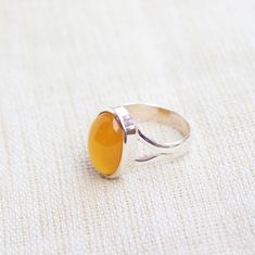 Gemstone - Mango Chalcedony Gemstone size - 10x14 mm Oval shape Metal - Sterling Silver Ring Size- All sizes available Each Ring made with Precision and love, these rings are perfect for everyday use and a perfect accessory to wear at work. Rings can be customized on request and gemstone can be switched to any other as per requirement. kindly visit my store to view the complete collection. Feel free to contact me for any queries regarding jewelry or for bulk order. The ring will be gift wrapped Yellow Oval Cabochon Ring For Gift, Yellow Oval Cabochon Gemstone Ring, Amber Rings With Large Stone For Anniversary, Mango Yellow, Chalcedony Crystal, Plus Size Rings, Stack Rings, Rings Anniversary, Handmade Jewelry Box