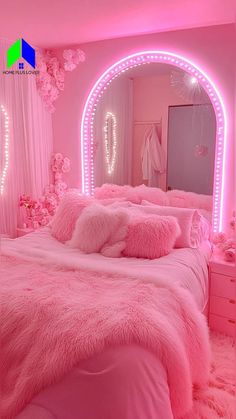 a bed with pink fur and lights in a room that looks like it has been decorated for