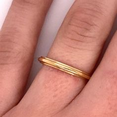 Vintage 1940's 14k yellow gold plain ridge band with Jabel trademark. The band is a size 7. The width of the band is 2.3mm. The height of the ring off the finger is 1.5mm. Timeless Gold Double Band, Timeless Double Band Gold Bands, Timeless Gold Double Band Stackable Rings, Gold 14k Midi Rings Round Band, 14k Gold Midi Rings With Round Band, Adjustable Gold Timeless Band, Timeless Adjustable Gold Bands, Timeless Stackable Yellow Gold Engraved Ring, Classic Adjustable 14k Gold Stackable Rings