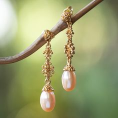 Bali sings a serenade of grandeur through these 18k gold-plated earrings, crafted by artisan Zayd Makarim. Classic trends inspire these dangle earrings, whose details mimic the region's royal ornaments. Peach cultured pearls add the final touch, evoking the island's dawn. Folk Art Jewelry, Pearl Dangle Earrings, Gold Dangle Earrings, Mens Jewelry Necklace, Art Earrings, Birthstone Earring, Final Touch, Pearl Earrings Dangle, Gold Earrings Dangle